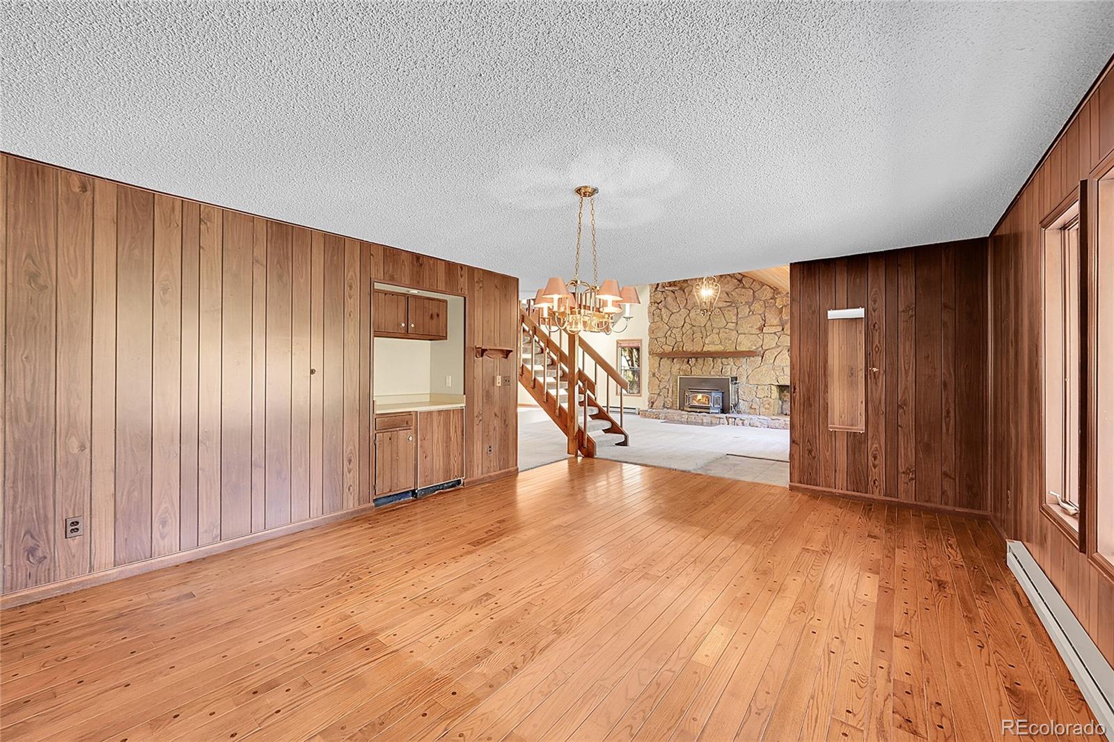 348 Nova Road Pine, CO 80470 - Photo 20 of 50 a view of empty room with wooden floor and fan