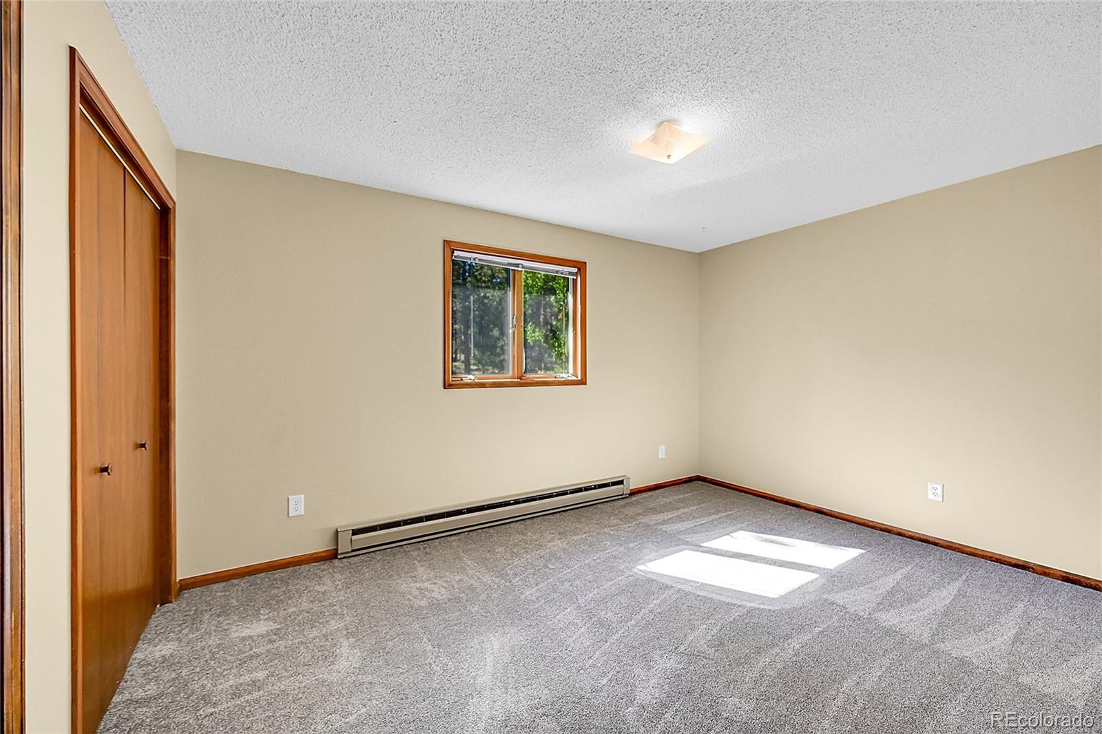 348 Nova Road Pine, CO 80470 - Photo 28 of 50 an empty room with windows