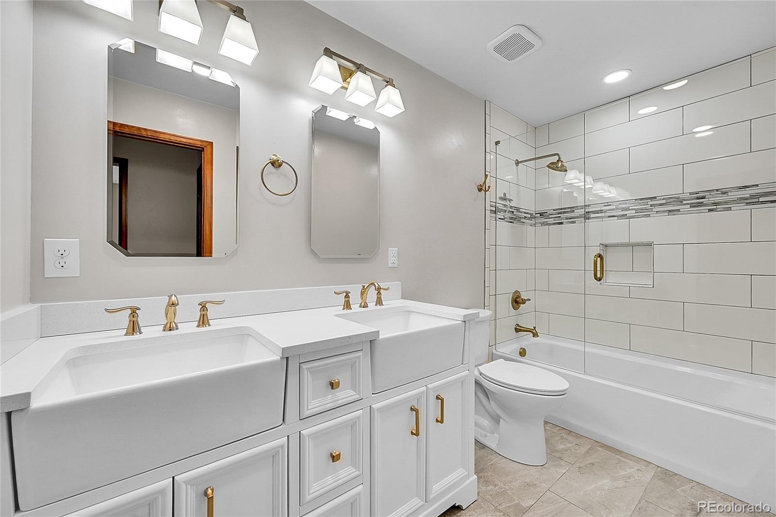 348 Nova Road Pine, CO 80470 - Photo 30 of 50 a bathroom with a double vanity sink mirror double and bathtub