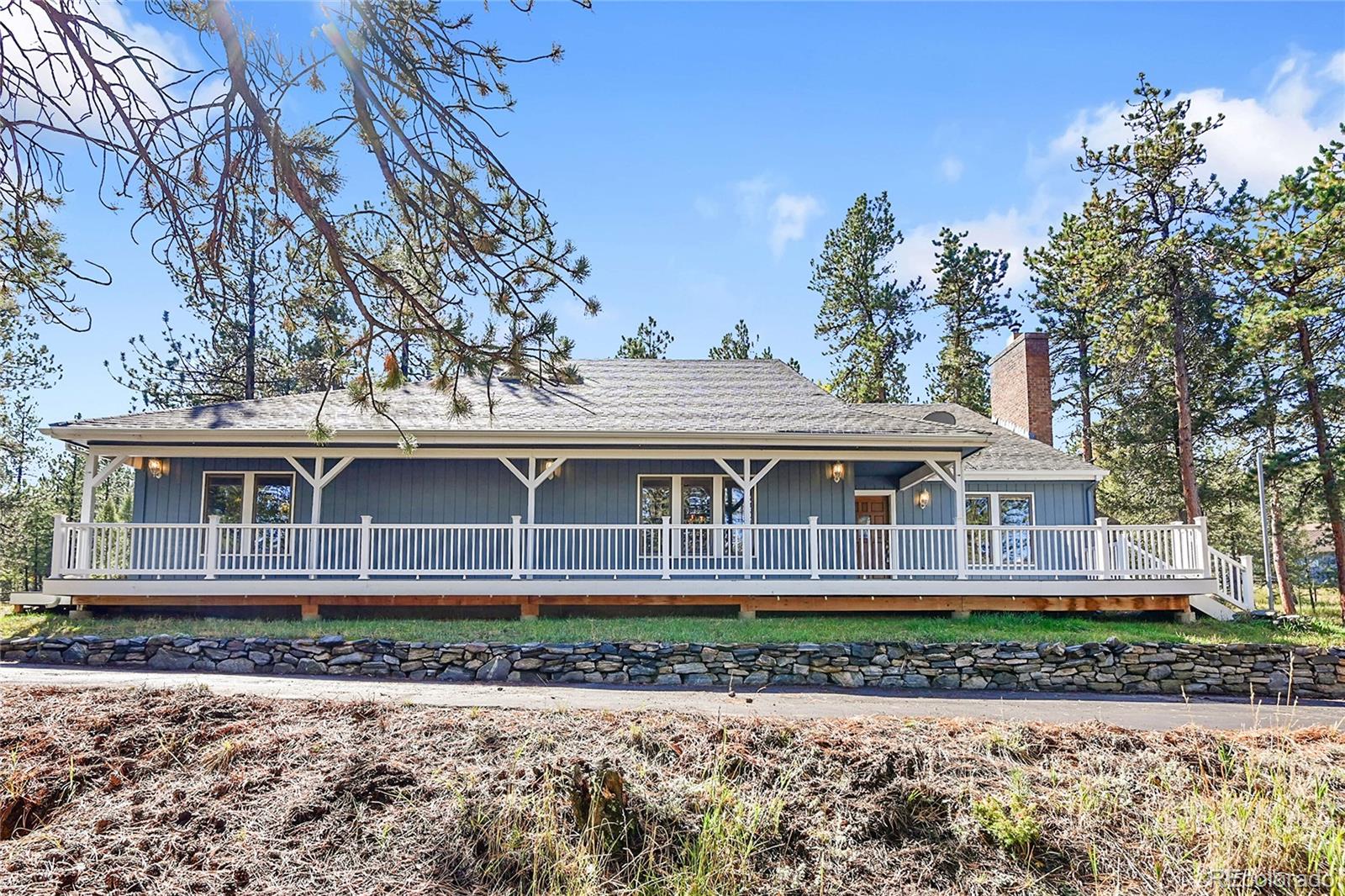 348 Nova Road Pine, CO 80470 - Photo 3 of 50 front view of a house with a yard