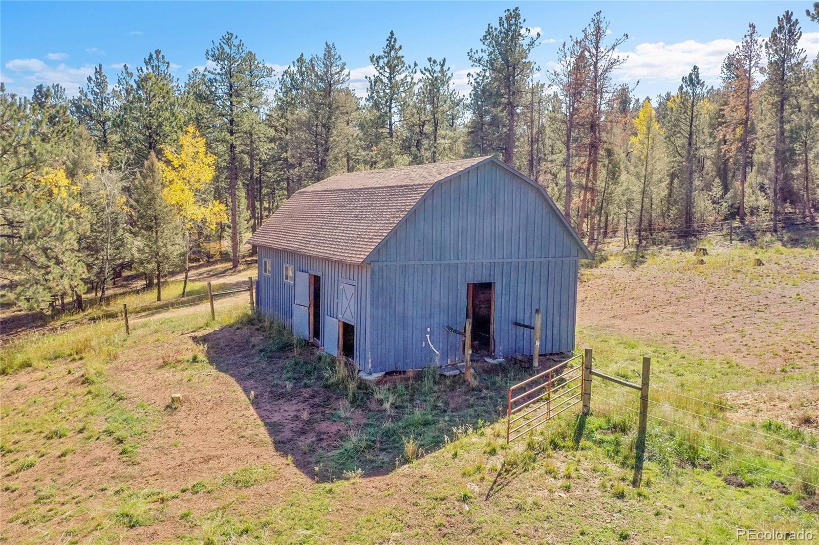 348 Nova Road Pine, CO 80470 - Photo 42 of 50 a house view with a backyard space