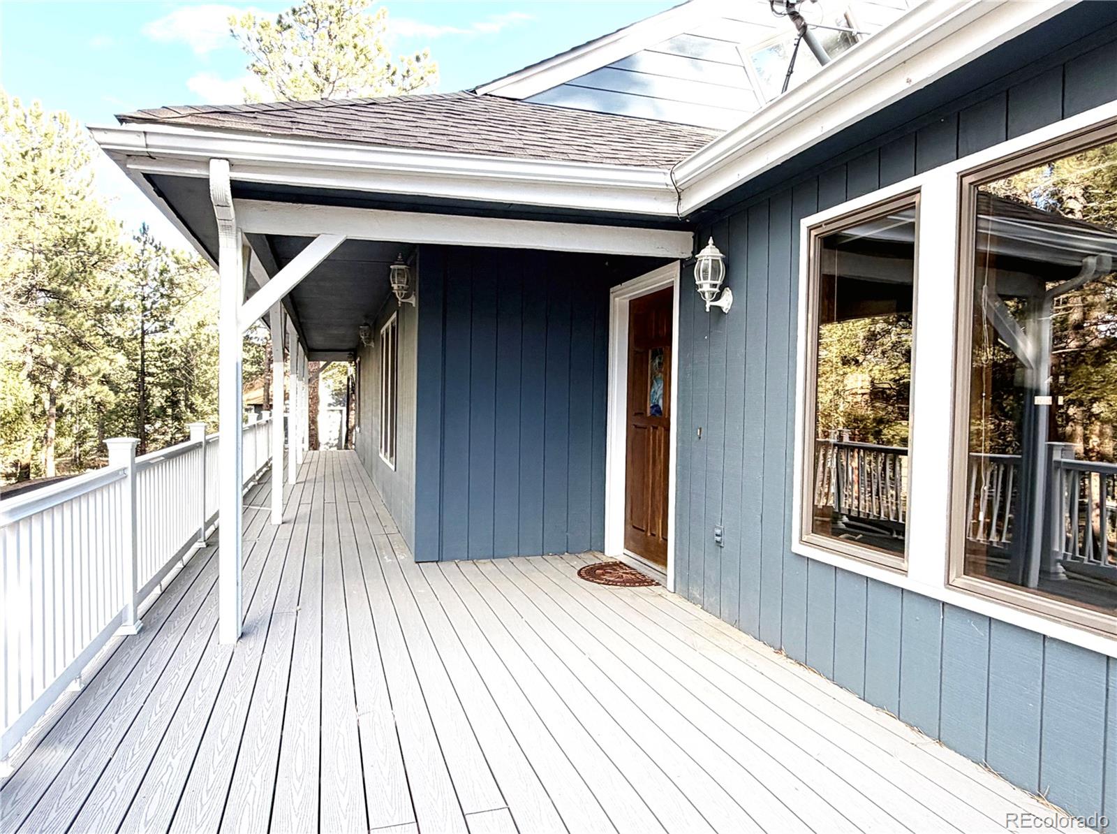 348 Nova Road Pine, CO 80470 - Photo 50 of 50 a view of a wooden door and outdoor space