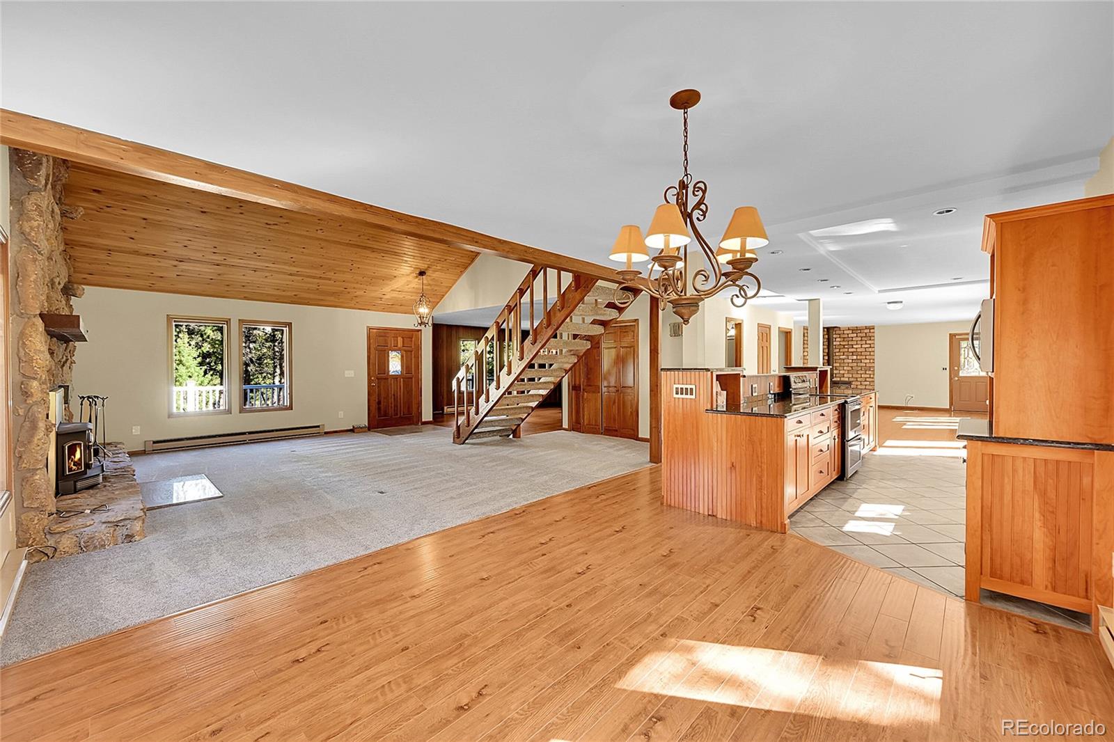 348 Nova Road Pine, CO 80470 - Photo 8 of 50 a view of a kitchen with refrigerator and a stove