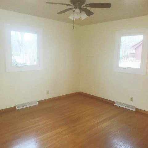 45-w005 Berner Road, Unit A Hampshire, IL 60140 - Photo 6 of 7 an empty room with a window and a fan