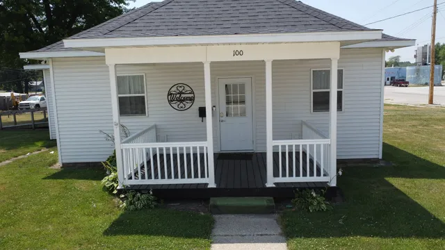 a front view of a house with garden