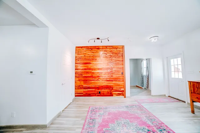 a view of room with window and hardwood floor