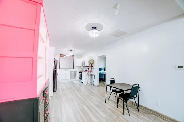 a view of a workspace with furniture and a workspace