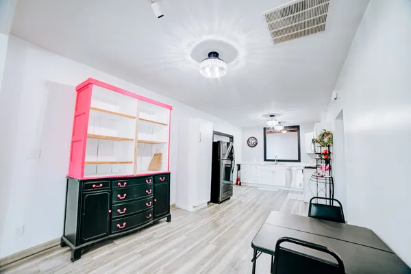 a view of workspace with furniture and window