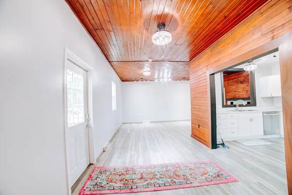 a view of hallway with wooden floor