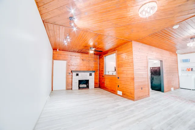 a view of an entryway with wooden floor