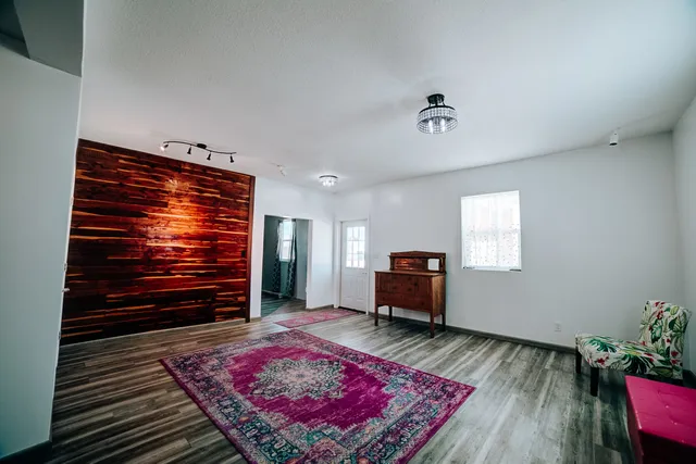 a living room with furniture and a rug