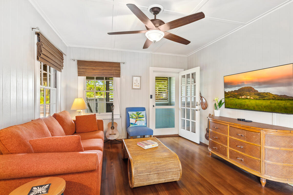 3895 Koloa Road, Unit 1 Koloa, HI 96756 - Photo 3 of 30 a living room with furniture and a flat screen tv