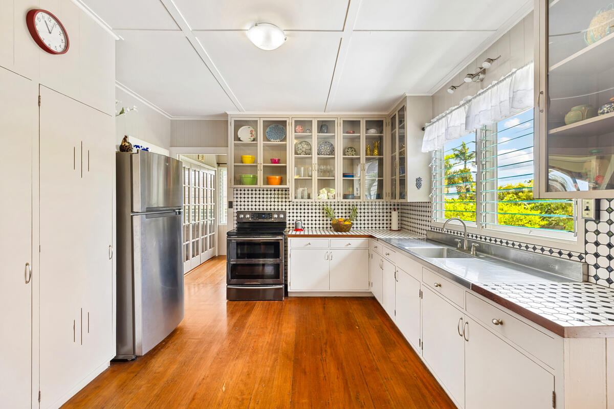 3895 Koloa Road, Unit 1 Koloa, HI 96756 - Photo 4 of 30 a kitchen with stainless steel appliances a refrigerator and a sink