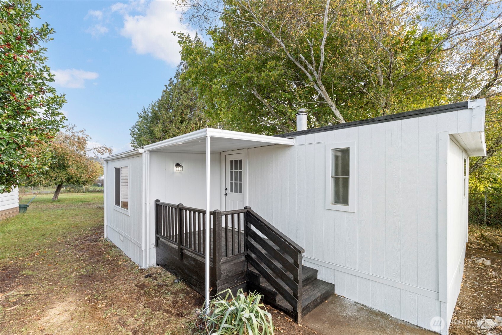 254 Ho Hum Lane Aberdeen, WA 98520 - Photo 21 of 27 a view of a house with backyard and trees