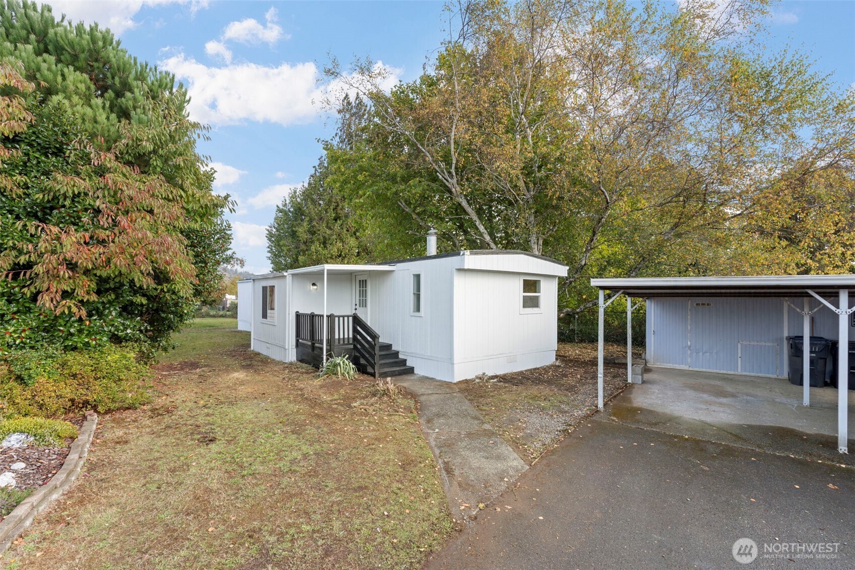 254 Ho Hum Lane Aberdeen, WA 98520 - Photo 22 of 27 a view of a house with a yard and large tree