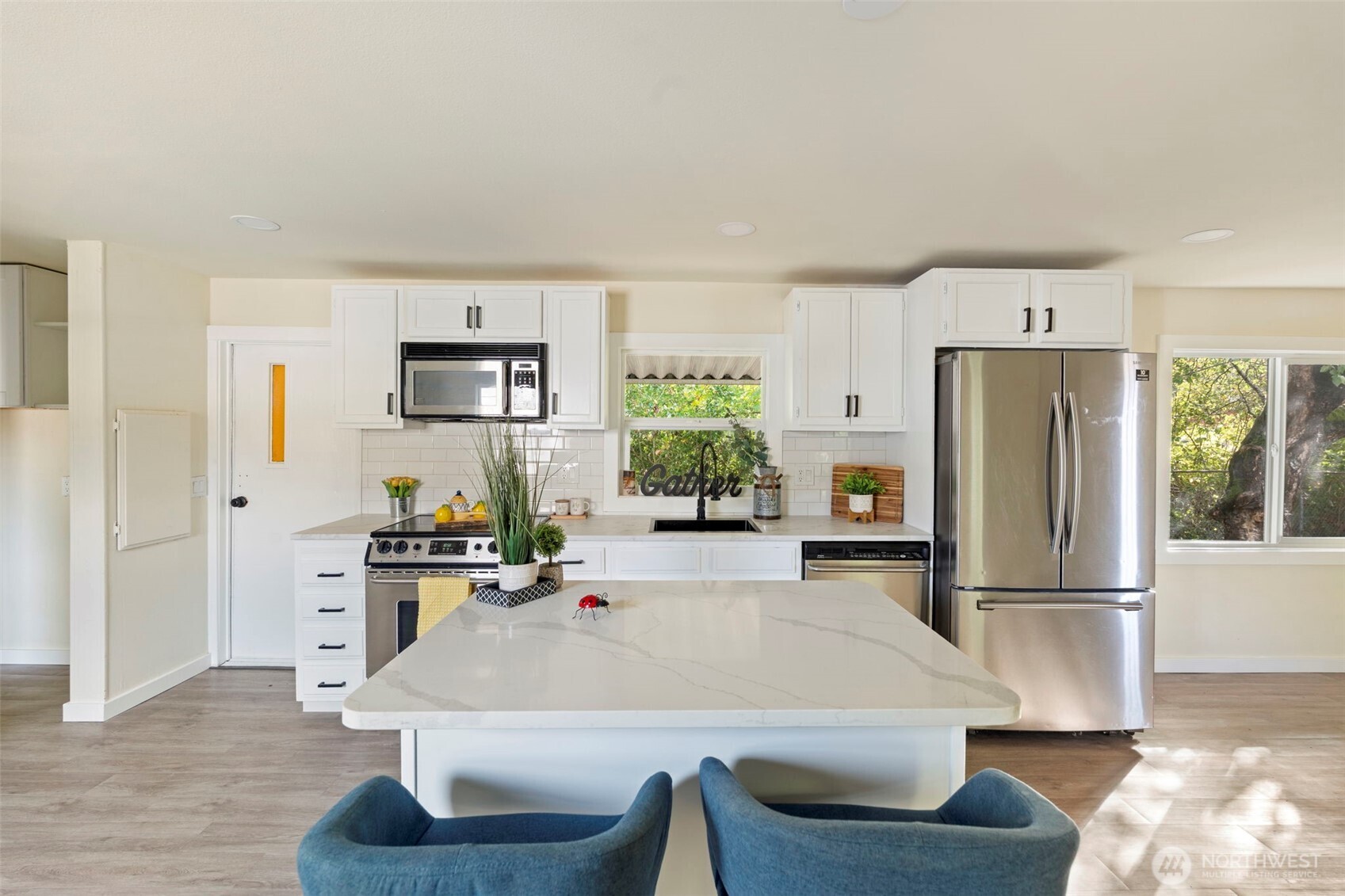 254 Ho Hum Lane Aberdeen, WA 98520 - Photo 4 of 27 a kitchen with granite countertop a refrigerator stove and sink