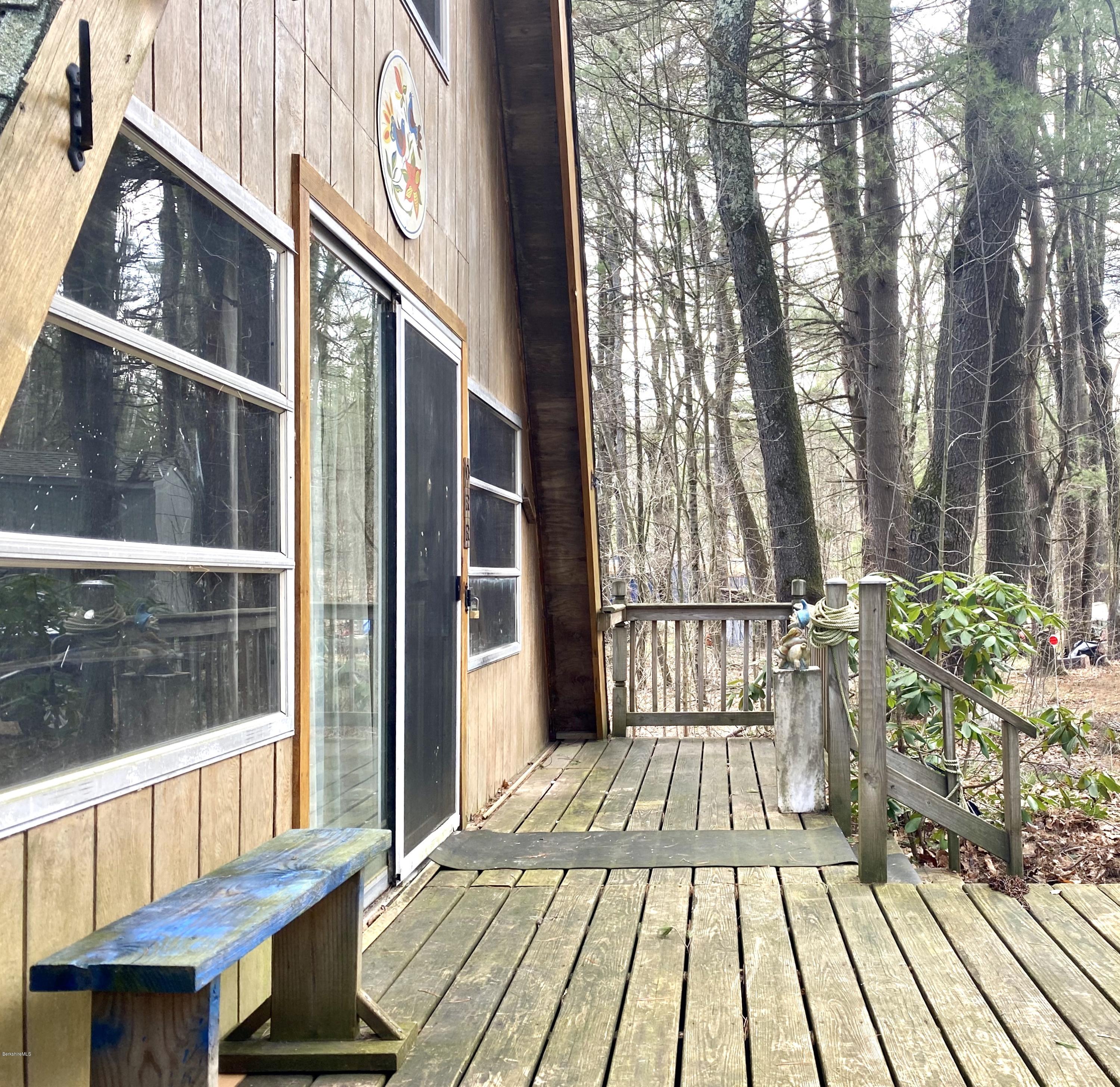 107 Peterson Road Becket, MA 01223 - Photo 2 of 34 a view of a house with a deck