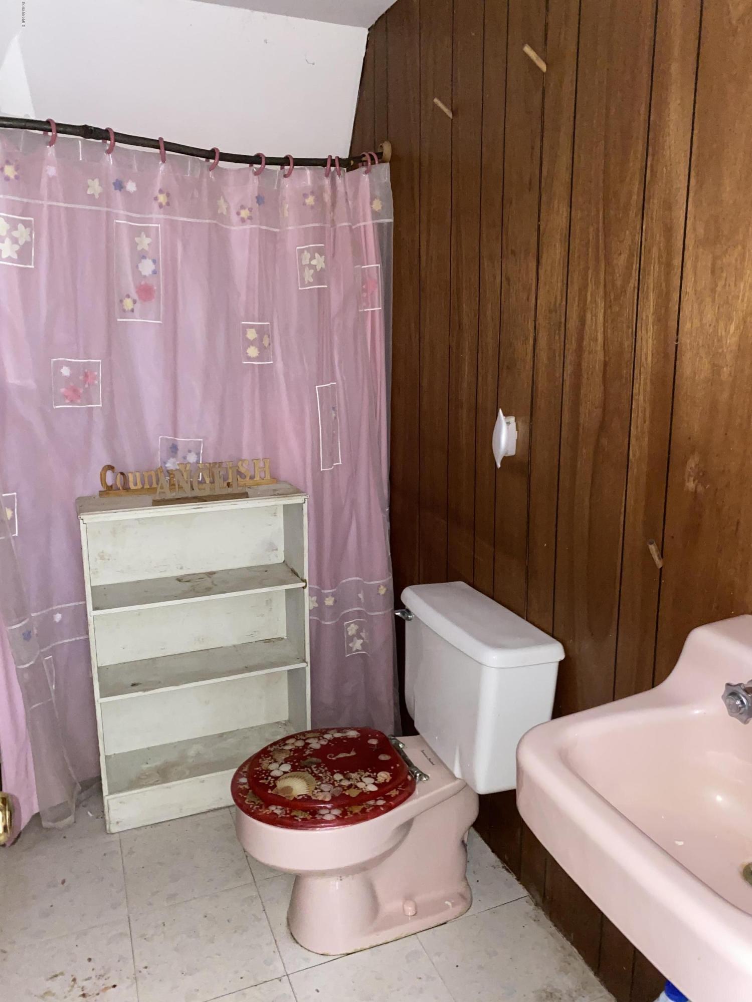 107 Peterson Road Becket, MA 01223 - Photo 15 of 34 a bathroom with a sink a toilet and a shower curtain