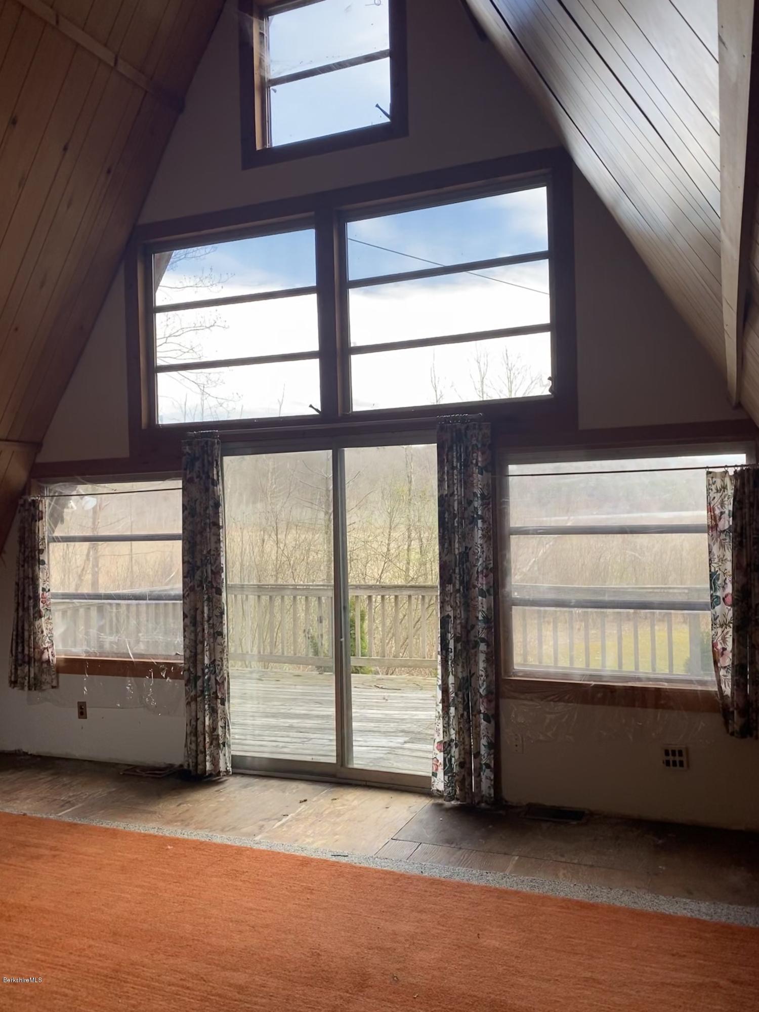 107 Peterson Road Becket, MA 01223 - Photo 17 of 34 a view of an empty room with a window