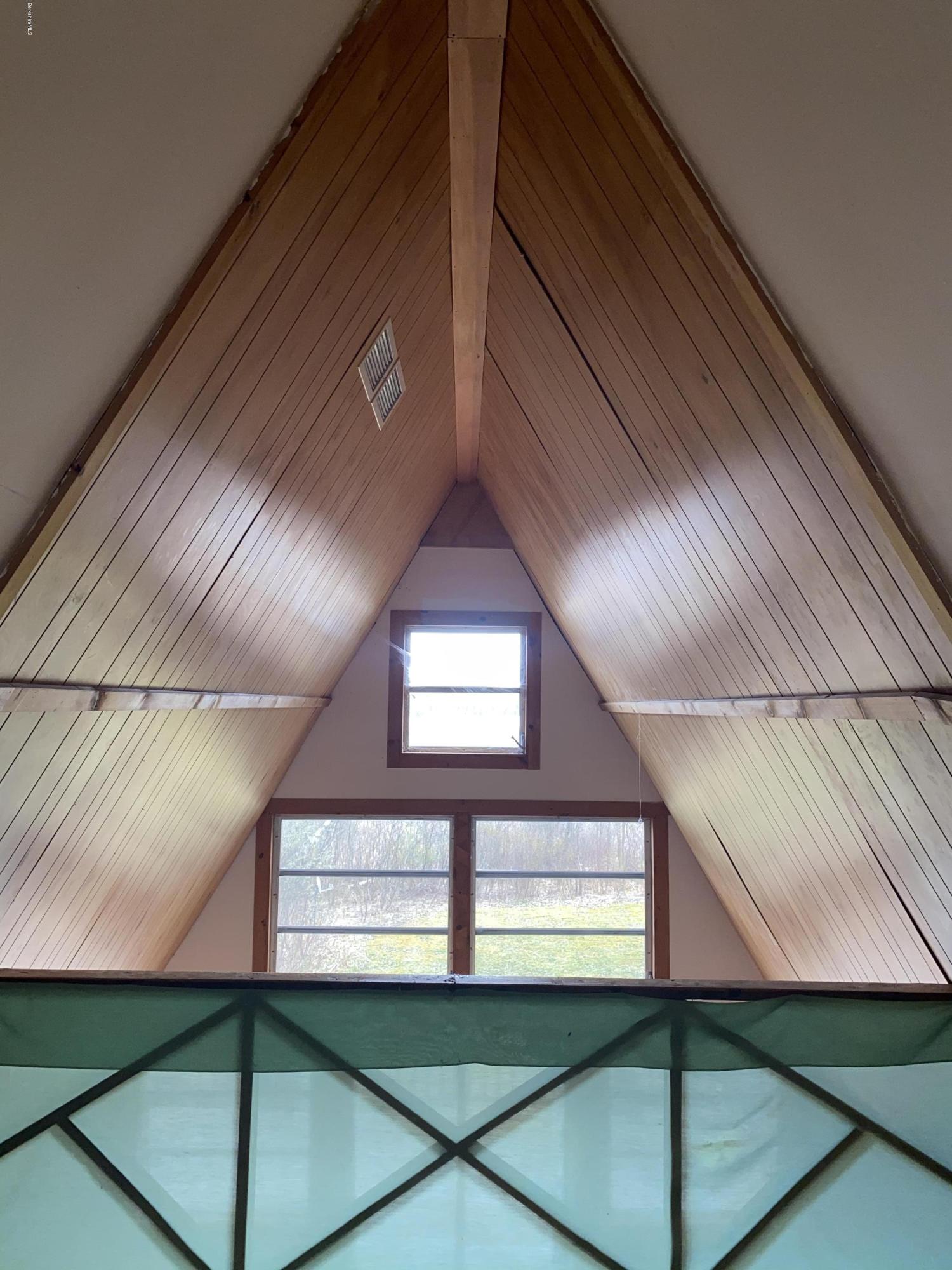 107 Peterson Road Becket, MA 01223 - Photo 20 of 34 a view of a hallway with a large window