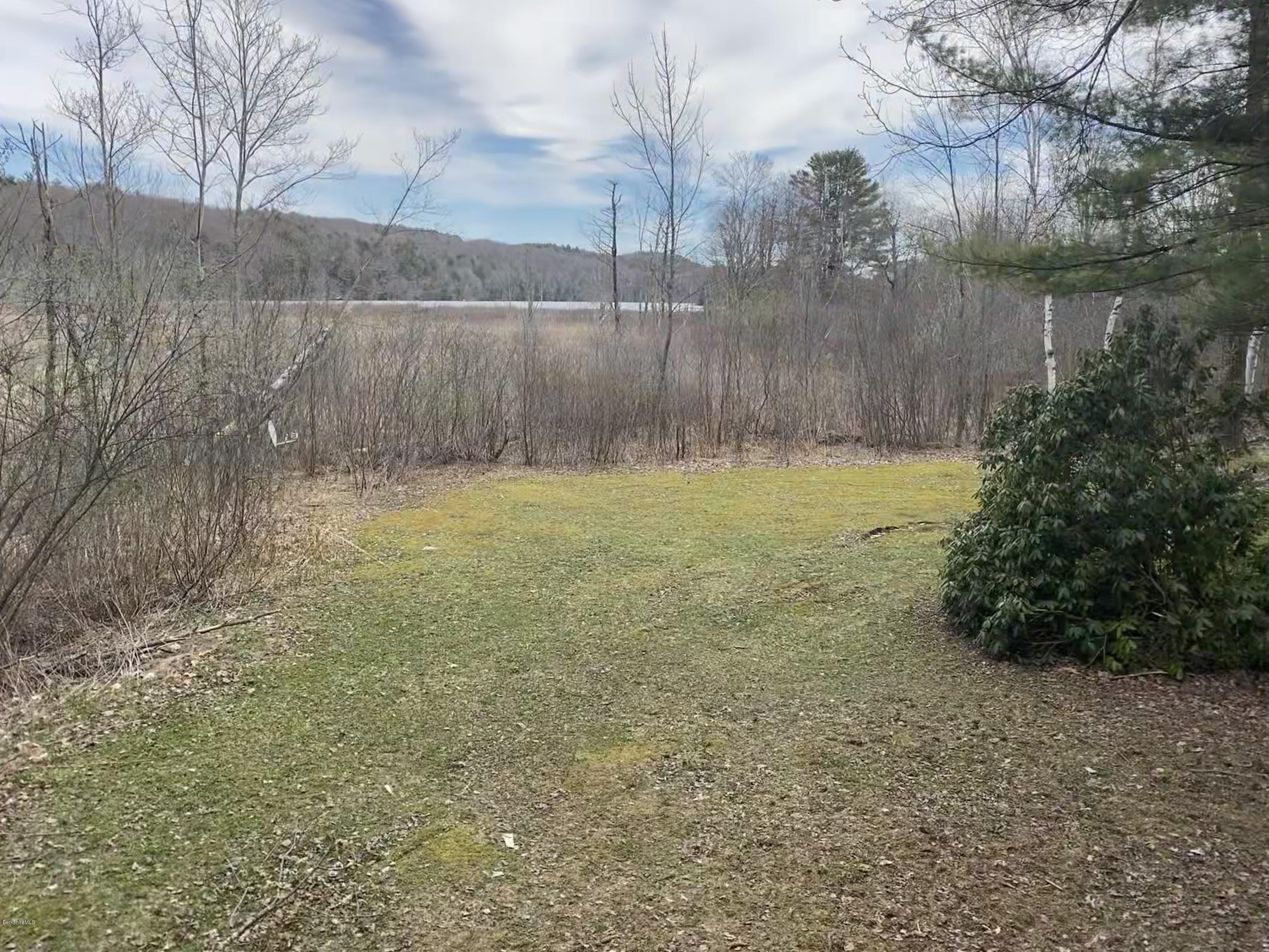 107 Peterson Road Becket, MA 01223 - Photo 25 of 34 a view of a yard with a bench
