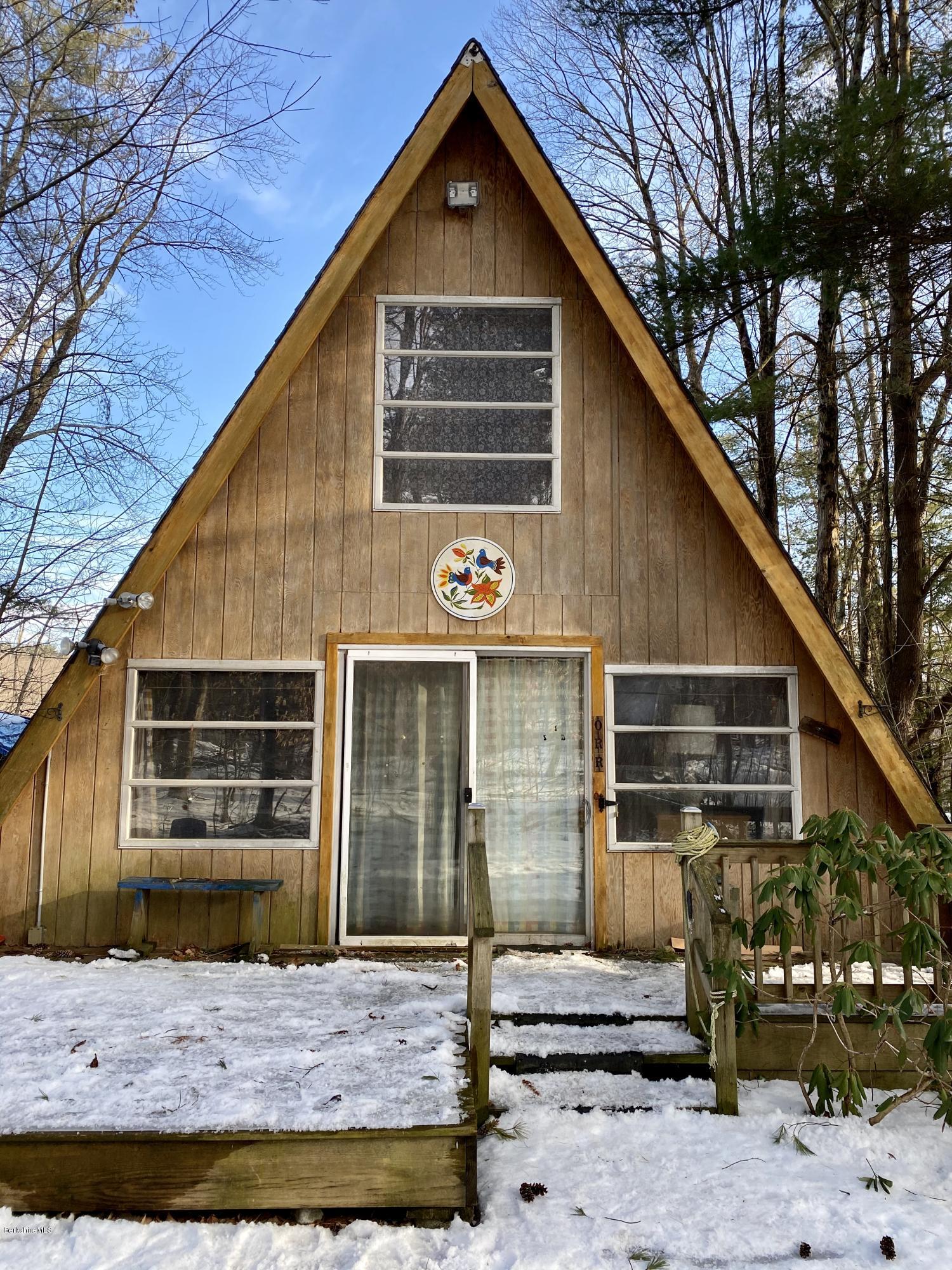 107 Peterson Road Becket, MA 01223 - Photo 27 of 34 a front view of a house with garden