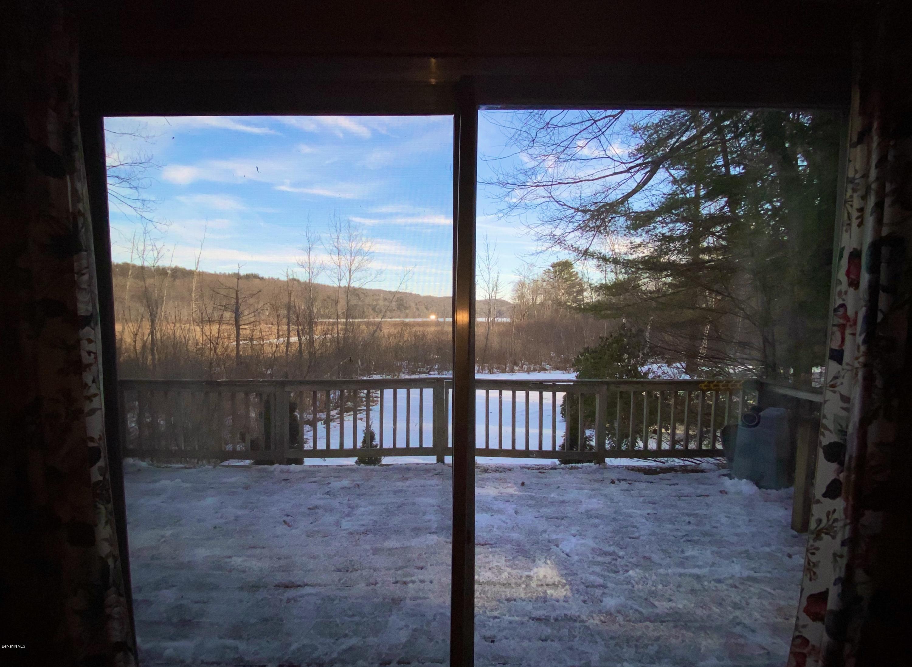 107 Peterson Road Becket, MA 01223 - Photo 28 of 34 a view of a porch with a yard