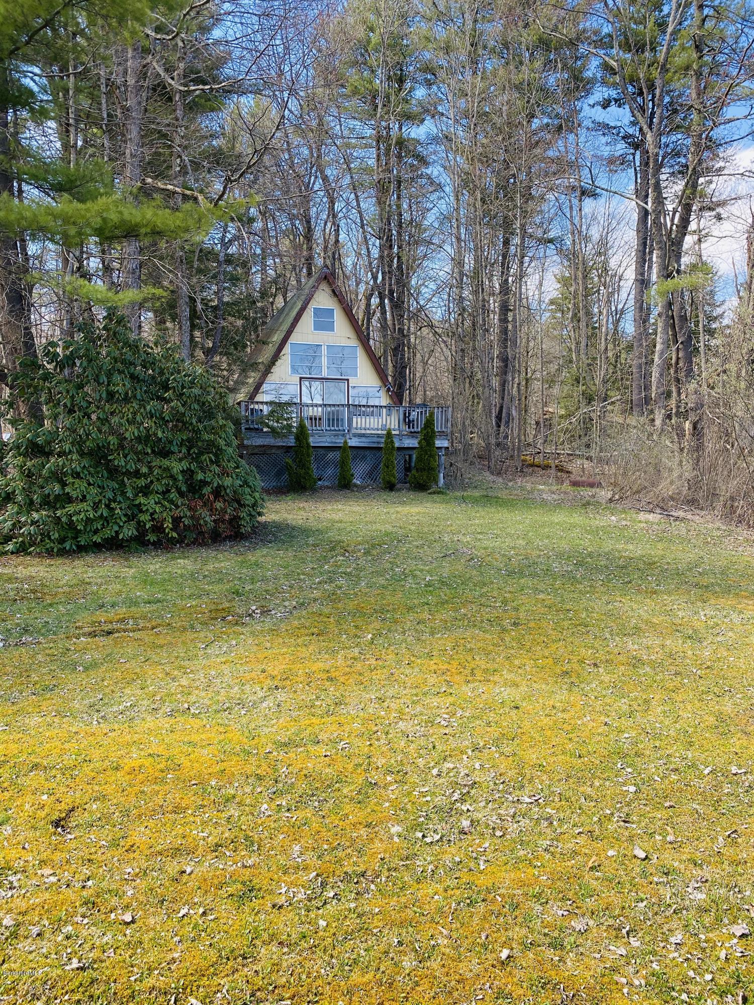 107 Peterson Road Becket, MA 01223 - Photo 4 of 34 a swimming pool with some trees in the background