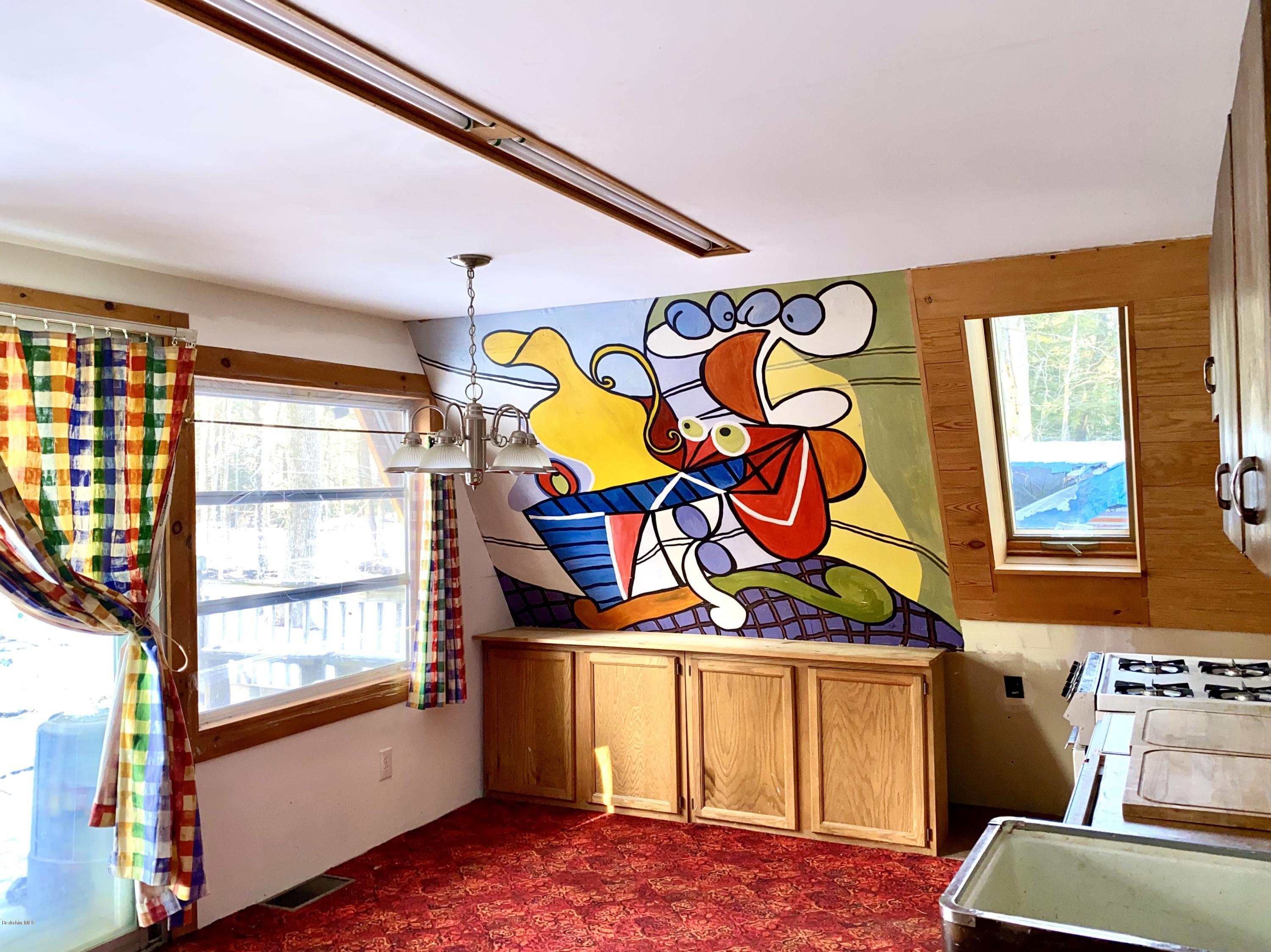 107 Peterson Road Becket, MA 01223 - Photo 8 of 34 a bed room with a bed and a window