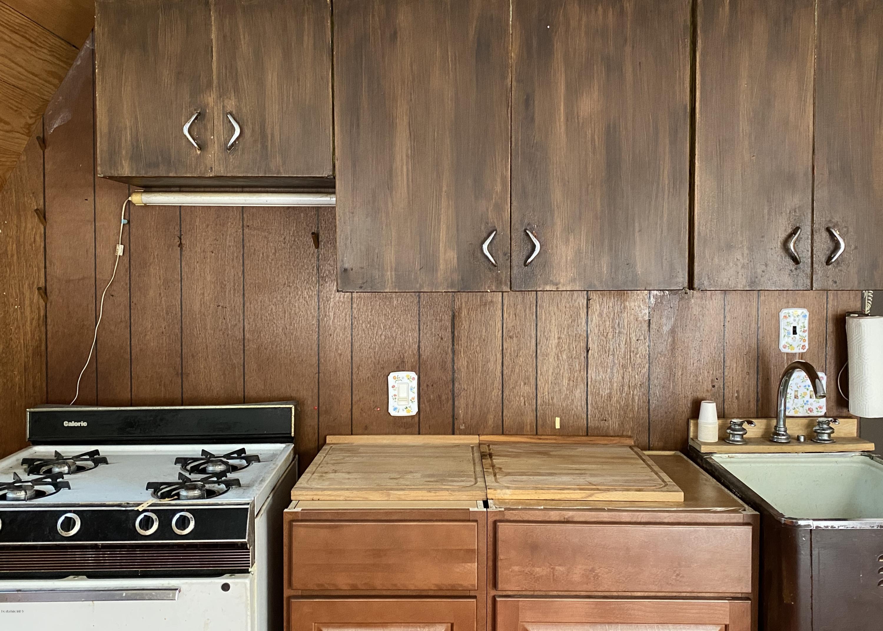 107 Peterson Road Becket, MA 01223 - Photo 9 of 34 a kitchen with a stove and a sink