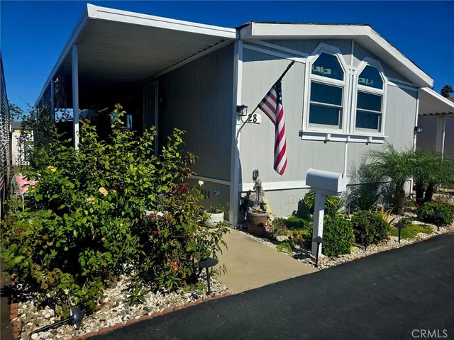 a view of a wooden fence and trees
