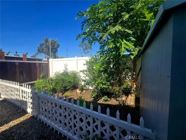 a front view of a house with sitting area