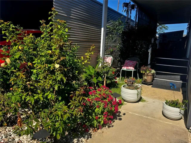 a bedroom with a bed and a night stand