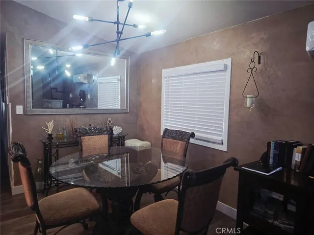 a view of a balcony with chairs potted plants