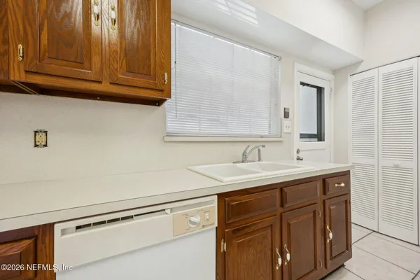 a view with cabinets a sink and dishwasher in it