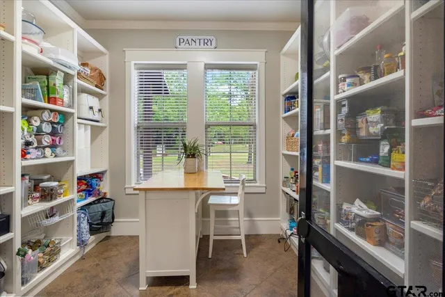 a room with furniture and a window