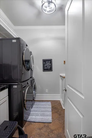 a kitchen with a stove a cabinets and wooden floor