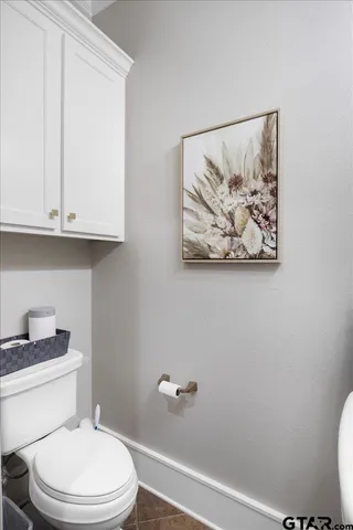 a bedroom with furniture and a large window