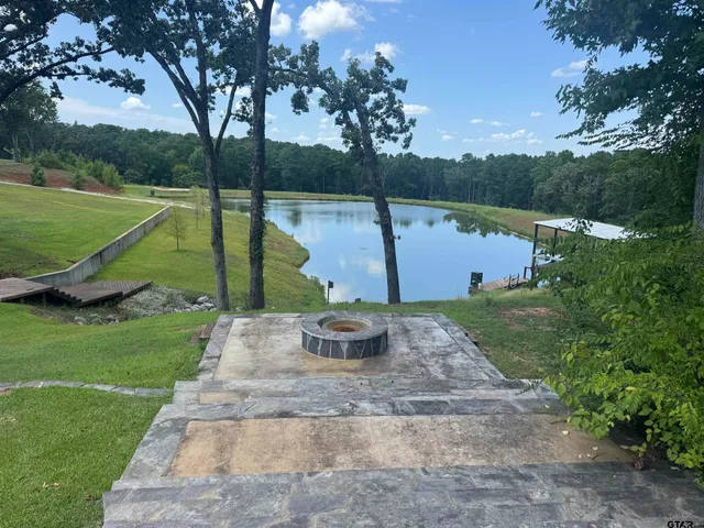 a view of swimming pool with a back yard