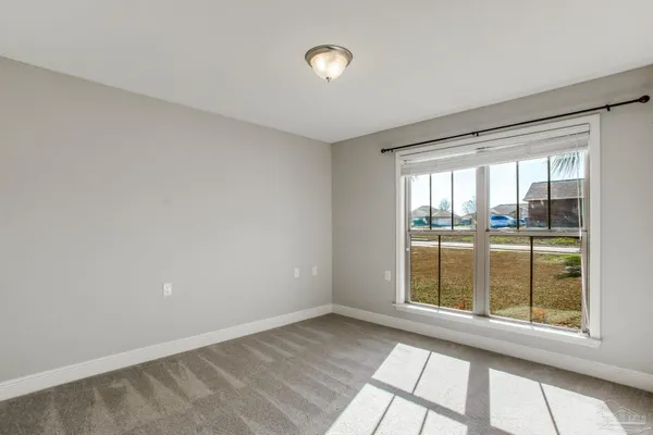 a view of an empty room and closet area