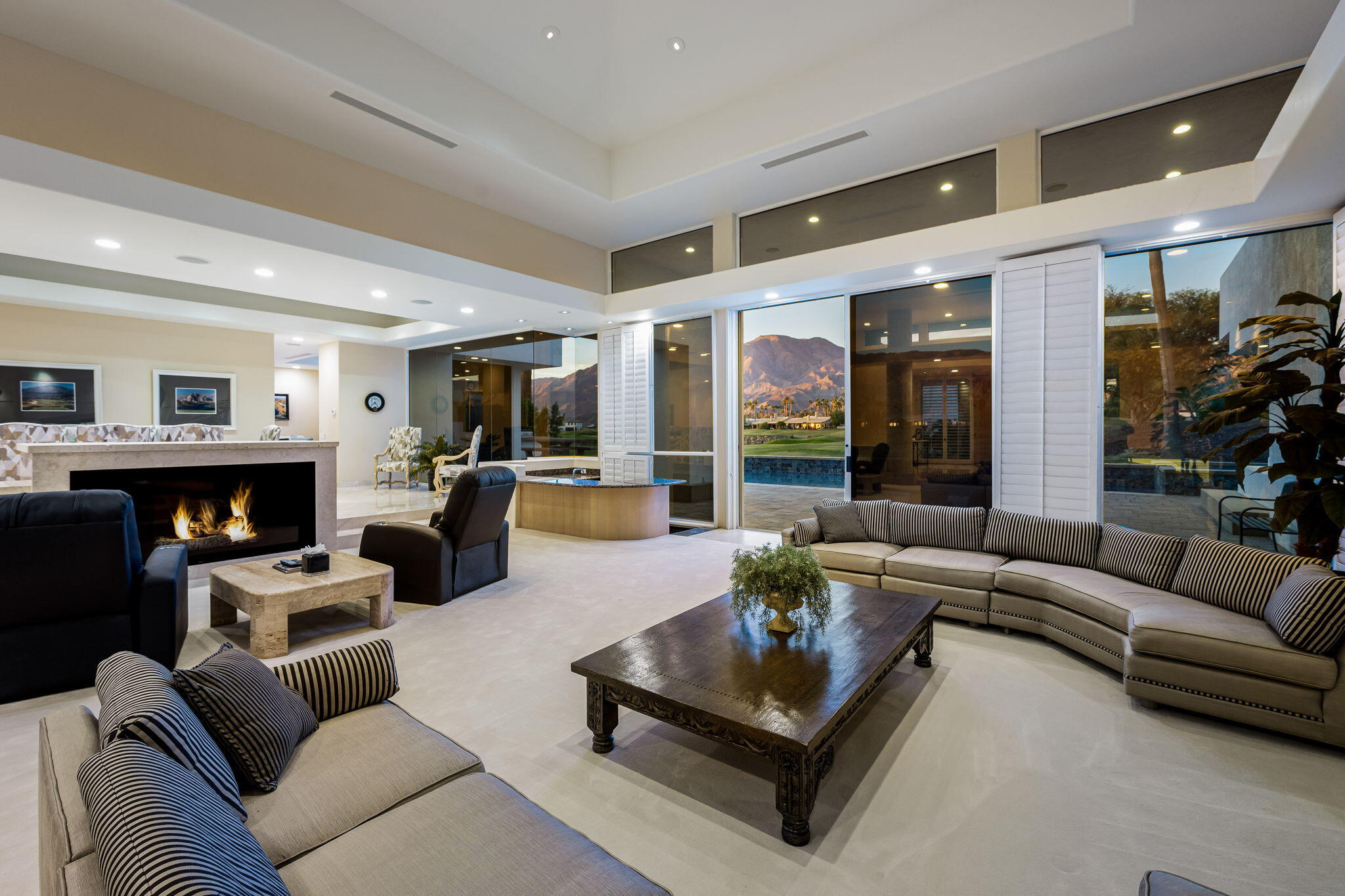 55305 Pebble Beach La Quinta, CA 92253 - Photo 13 of 65 a living room with fireplace furniture and a large window