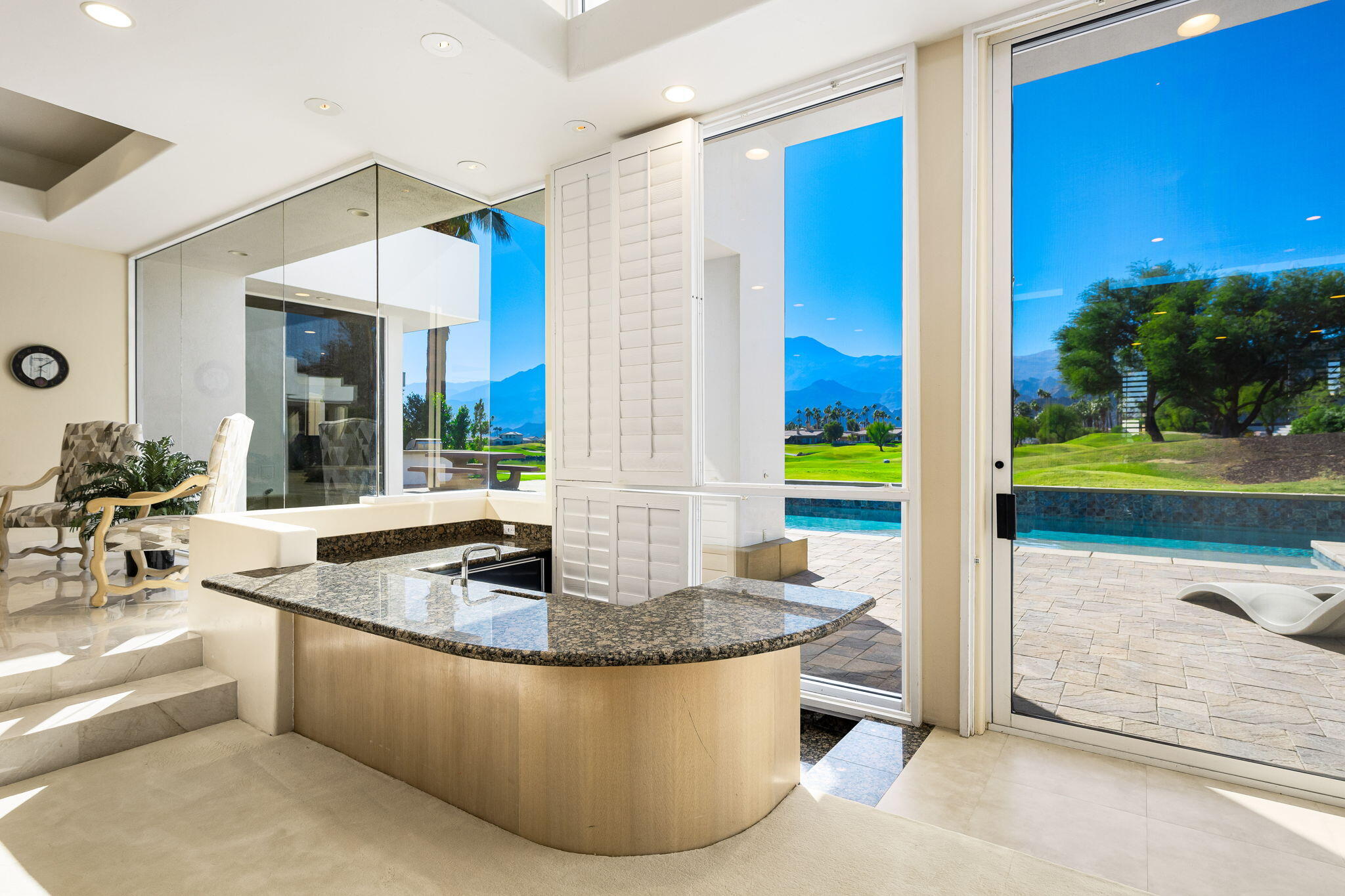 55305 Pebble Beach La Quinta, CA 92253 - Photo 14 of 65 a kitchen with a sink and a large window