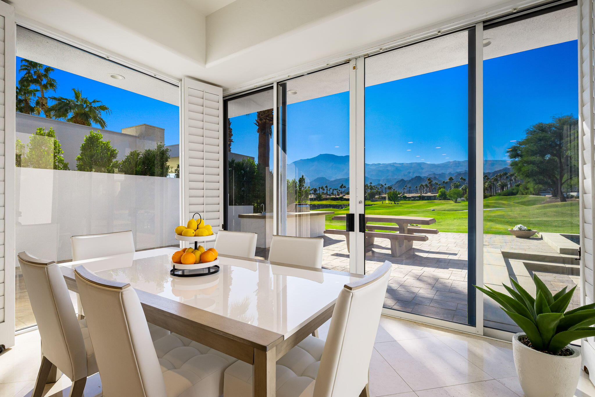 55305 Pebble Beach La Quinta, CA 92253 - Photo 22 of 65 a view of a dining room with a table and chairs
