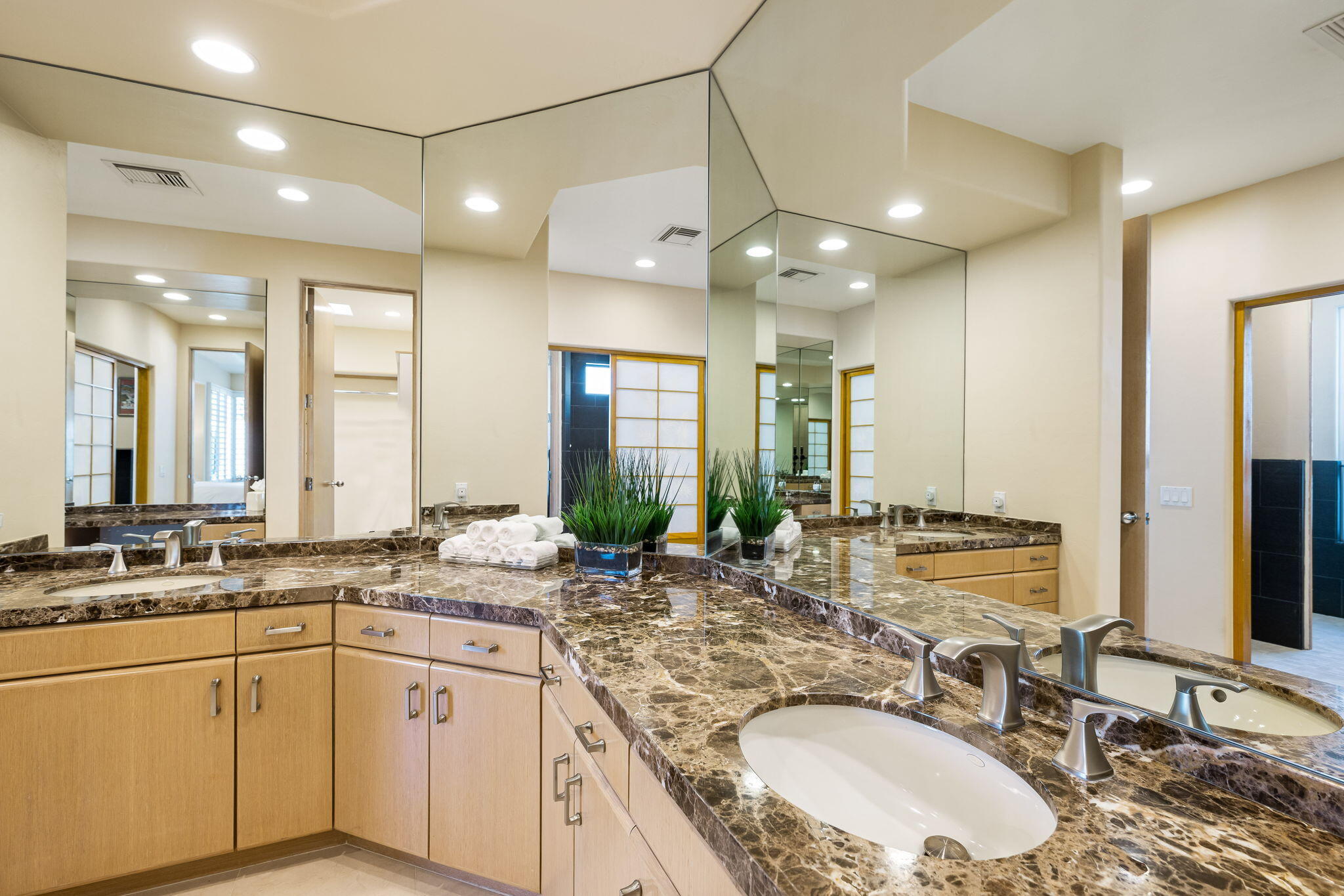 55305 Pebble Beach La Quinta, CA 92253 - Photo 32 of 65 a bathroom with a granite countertop sink double vanity and a mirror