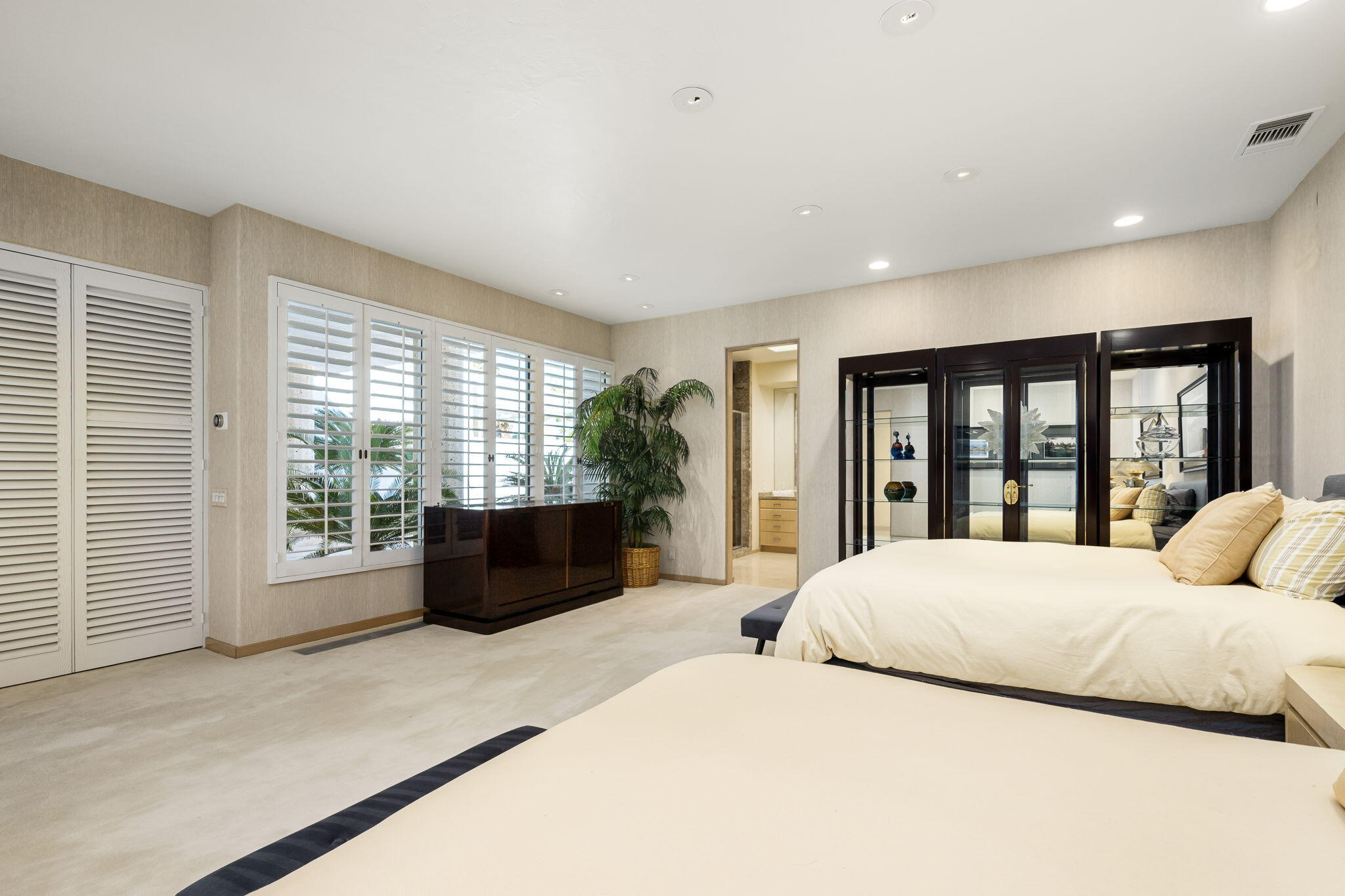 55305 Pebble Beach La Quinta, CA 92253 - Photo 36 of 65 a bedroom with a large bed and a large window