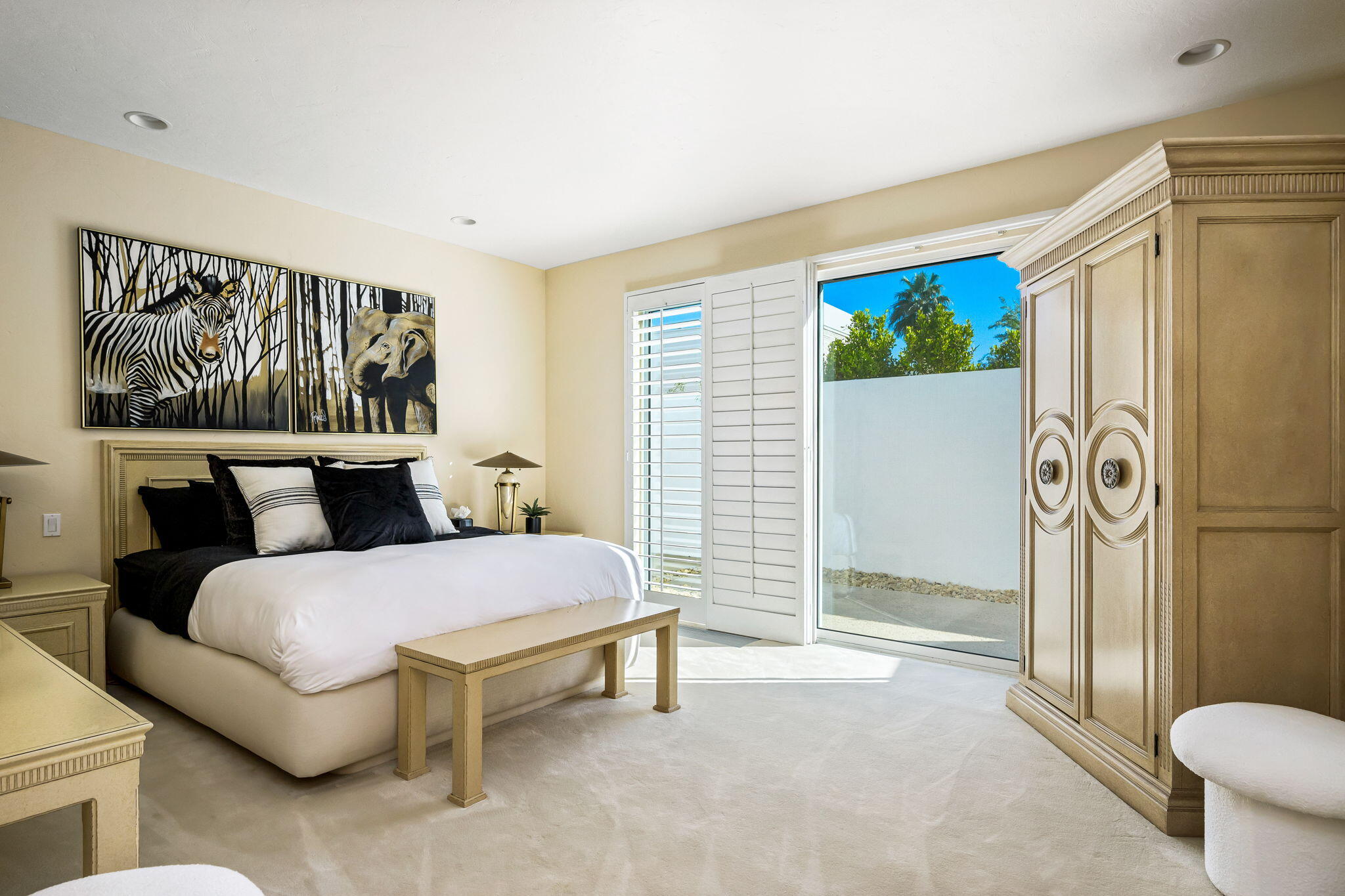 55305 Pebble Beach La Quinta, CA 92253 - Photo 38 of 65 a spacious bedroom with a bed and a couch