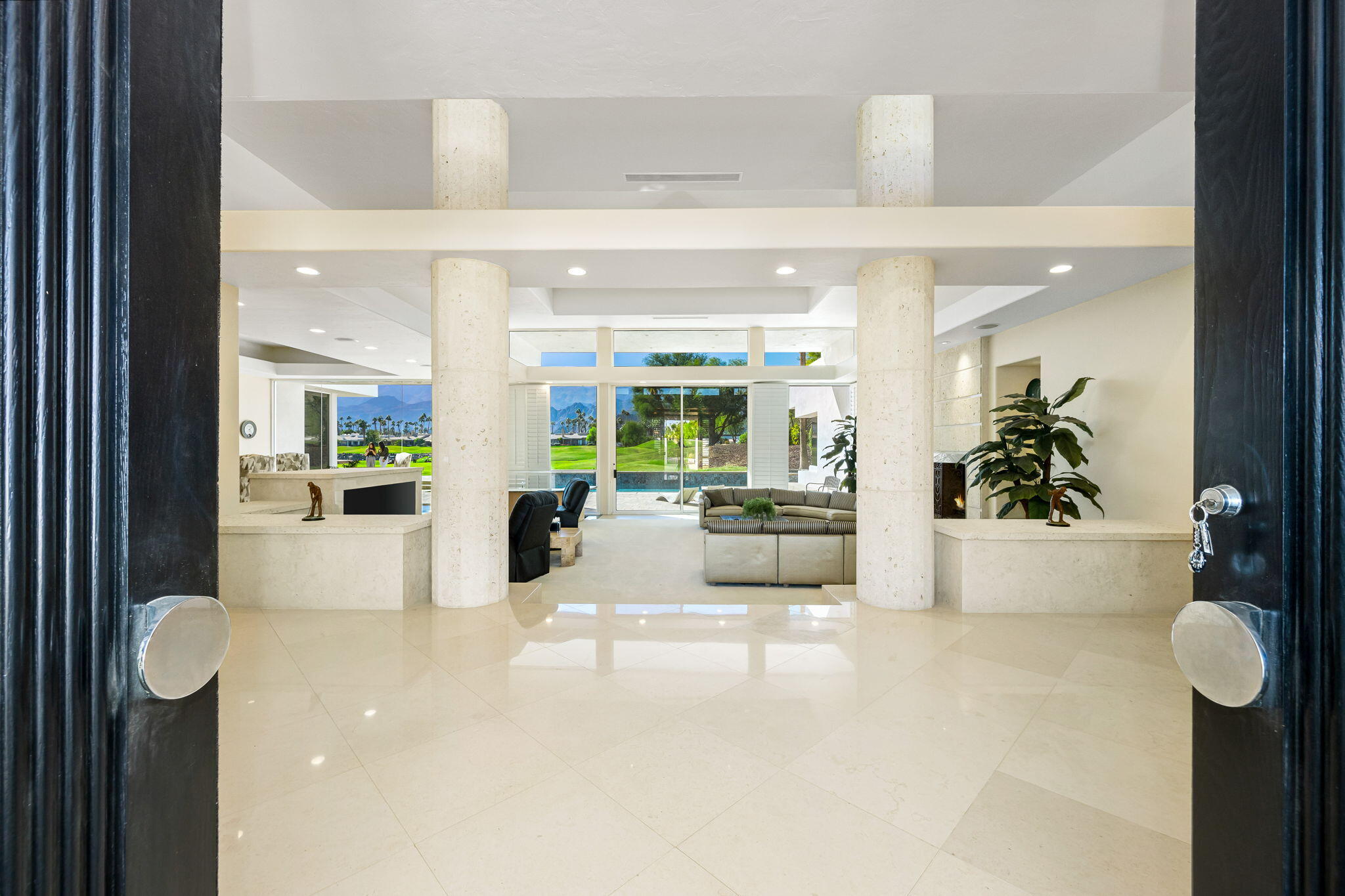 55305 Pebble Beach La Quinta, CA 92253 - Photo 6 of 65 a view of a hallway with furniture and a chandelier
