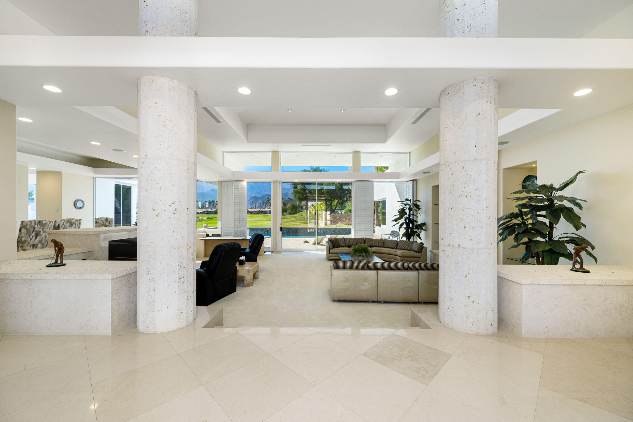 55305 Pebble Beach La Quinta, CA 92253 - Photo 7 of 65 a large white kitchen with stainless steel appliances