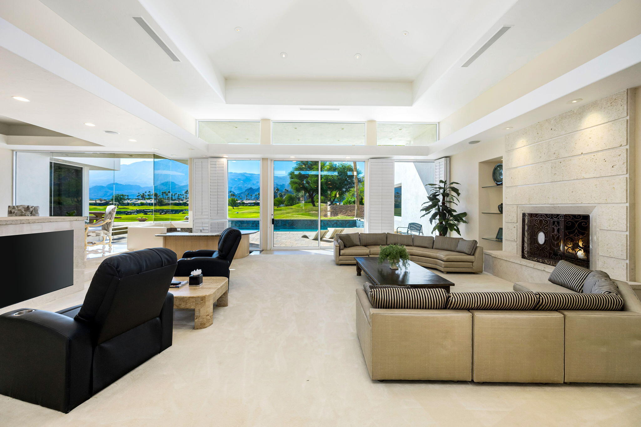 55305 Pebble Beach La Quinta, CA 92253 - Photo 8 of 65 a living room with furniture and a fireplace