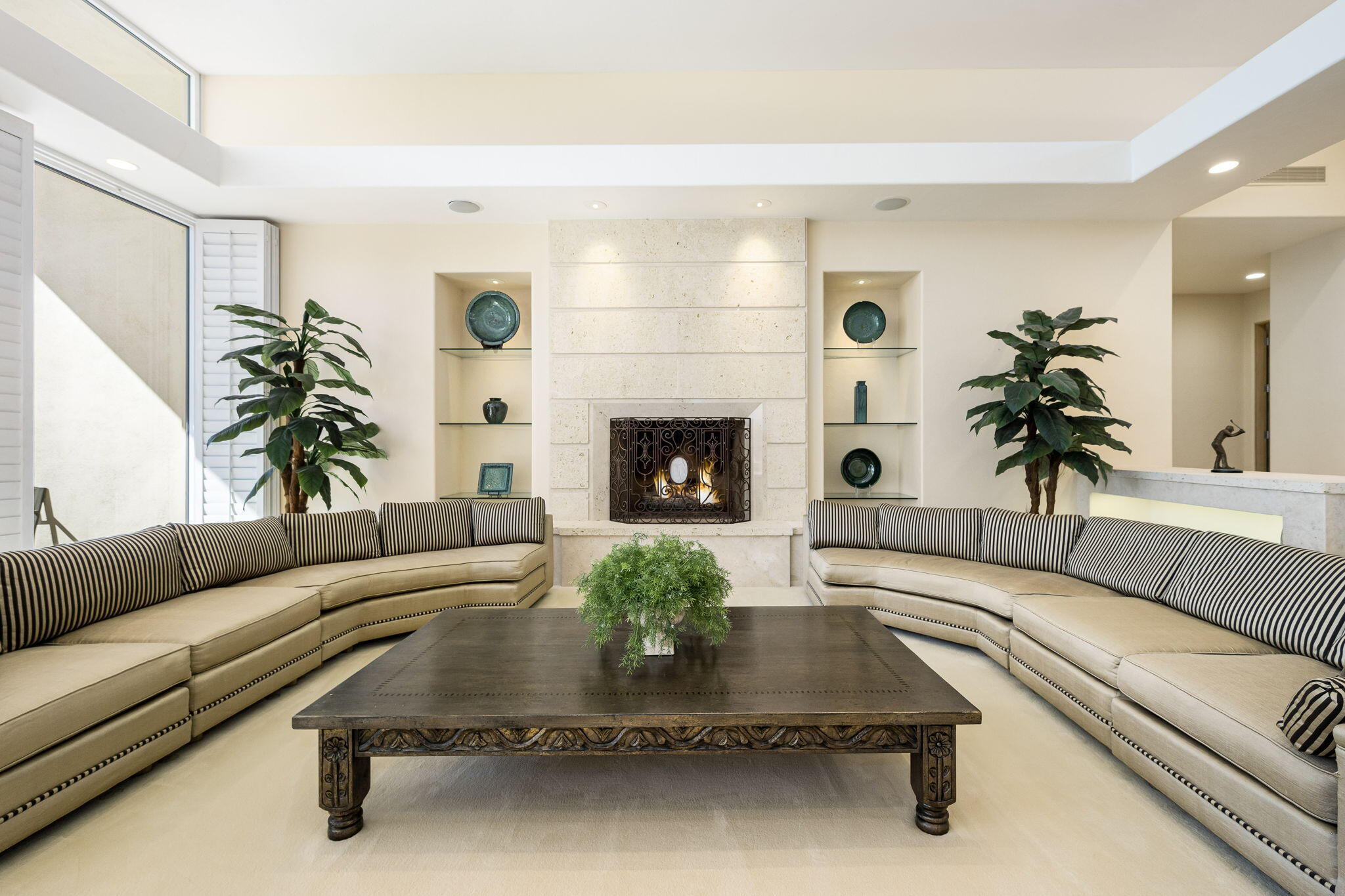 55305 Pebble Beach La Quinta, CA 92253 - Photo 10 of 65 a living room with furniture fireplace and potted plant